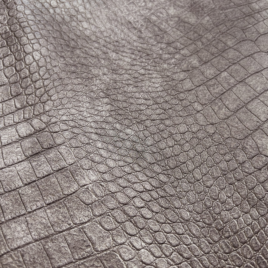 https://www.croftmill.co.uk/images/pictures/00-2023/10-october-2023/croco_skin_pewter_polyester_polyurethane_faux_leather_crocodile_print_fabric.jpg?v=3fa87832
