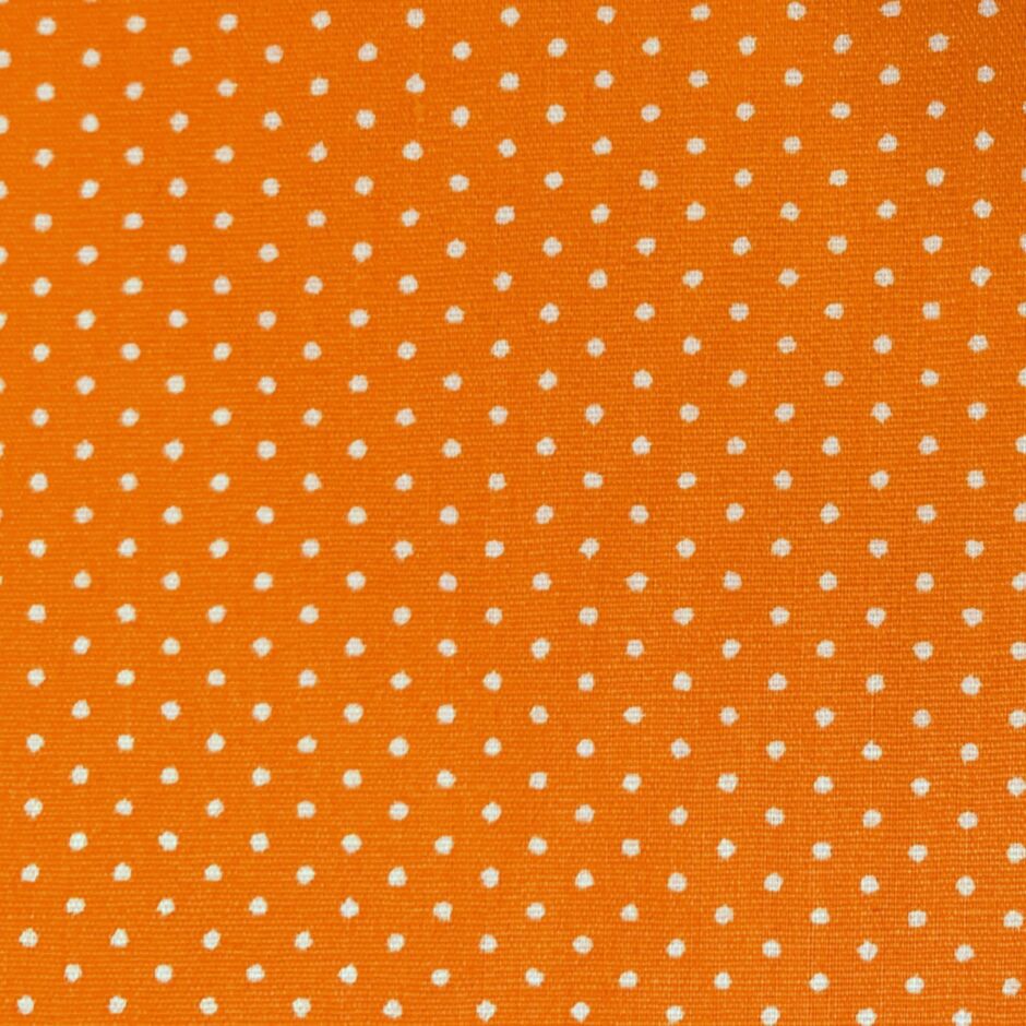 white fabric with orange polka dots